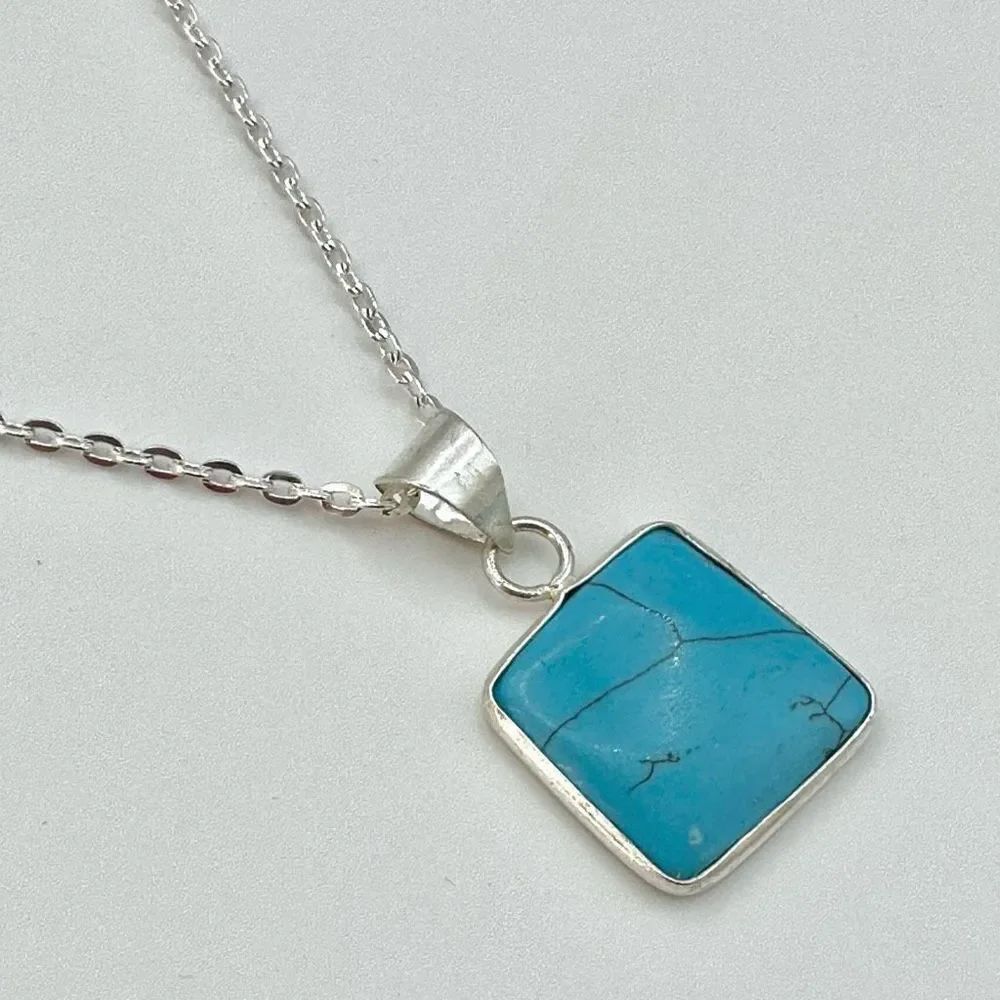 Silver tone blue square pendant necklace